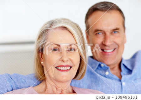 Elderly, couple and portrait or happy on sofa with support, relationship and marriage in retirement home. Senior, man and woman with smile on couch in living room with trust, care and love in house Elderly, couple and portrait or happy on sofa with support, relationship and marriage in retirement home. Senior, man and woman with smile on couch in living room with trust, care and love in house 109496131