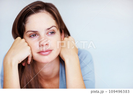 Rest, thinking and face of woman in bedroom for sleeping, dreaming and comfortable at home. Wondering, thoughtful and person in relax, reflect and wake up for health, wellness and calm in morning 109496383
