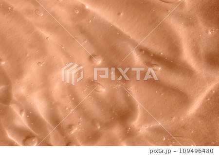Texture of transparent pastel colored gel with air bubbles and waves. Trendy color 2024 Peach Buzz. Liquid beauty product closeup. Skincare, body care, wellness, beauty. Backdrop, flat lay Texture of transparent pastel colored gel with air bubbles and waves. Trendy color 2024 Peach Buzz. Liquid beauty product closeup. Skincare, body care, wellness, beauty. Backdrop, flat lay 109496480