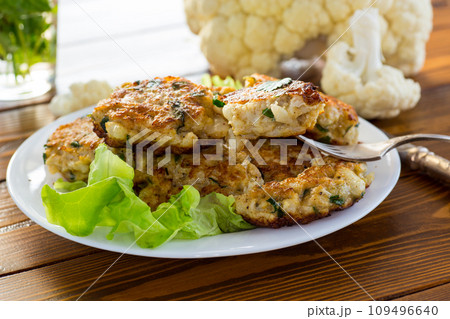 cooked vegetarian fried cauliflower cutlets in a plate 109496640