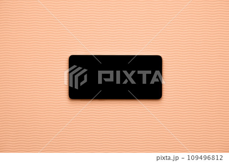 Horizontal blank phone on wave background. Healthcare and vacation applications peach color of the year 2024 109496812