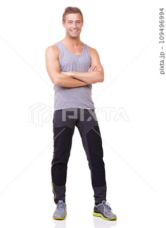 Portrait, man and confident for fitness, studio and happy with training wellness in gym clothes. Person, pride and smile face with commitment to health body, exercise and relax by white background Portrait, man and confident for fitness, studio and happy with training wellness in gym clothes. Person, pride and smile face with commitment to health body, exercise and relax by white background 109496994