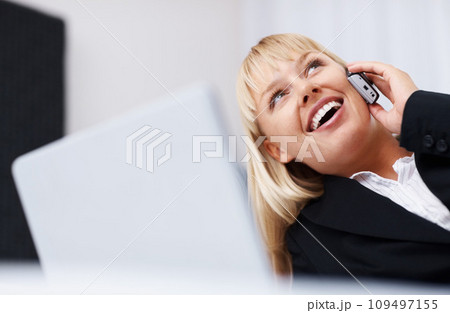 Businesswoman, thinking or phone call with laptop for communication in home office for consult, feedback or report. Person, lying and bed with idea, vision and smile for future, planning or growth 109497155