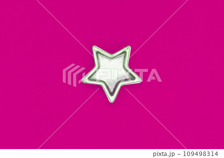 Christmas five pointed golden star on pink background. Christmas decoration. Christmas five pointed golden star on pink background. Christmas decoration. 109498314
