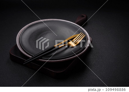 Empty round ceramic plate as an item of kitchen utensils Empty round ceramic plate as an item of kitchen utensils 109498886