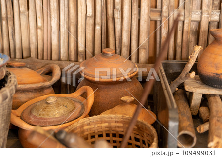 A wide variety of kitchen utensils for traditional Asian cooking. 109499031