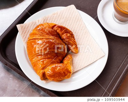Fresh crisp delicious French croissant with cup of fragrant coffee Fresh crisp delicious French croissant with cup of fragrant coffee 109503944
