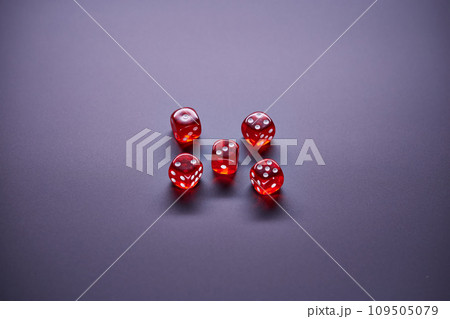 Red dices on grey background. Copy space. 109505079
