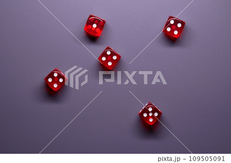 Red dices on grey background. Copy space. 109505091