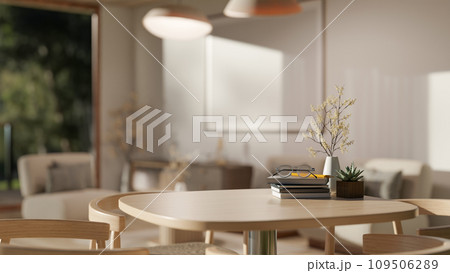 Close-up image of a copy space on a wooden table in a beautiful modern living room. Close-up image of a copy space on a wooden table in a beautiful modern living room. 109506289