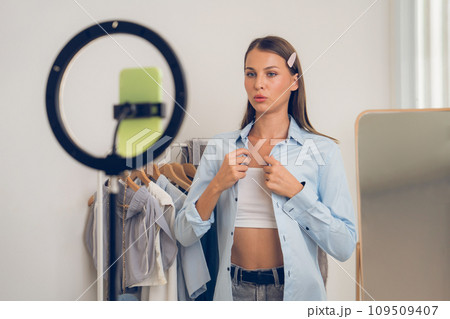 Young woman making fashion video content for social media. Unveiling 109509407