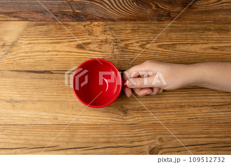 Hand Holds Cup, Empty Red Cup in Hands, Coffee Mug, Teacup, Hot Beverage Mockup Hand Holds Cup, Empty Red Cup in Hands, Coffee Mug, Teacup, Hot Beverage Mockup 109512732