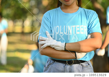 Man in volunteer uniform standing with arms crossed while standing outdoor Man in volunteer uniform standing with arms crossed while standing outdoor 109513029