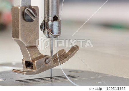 Sewing machine needle with thread and fabric Sewing machine needle with thread and fabric 109513565