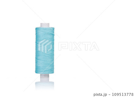 a skein of threads of blue color macro on a white background 109513778