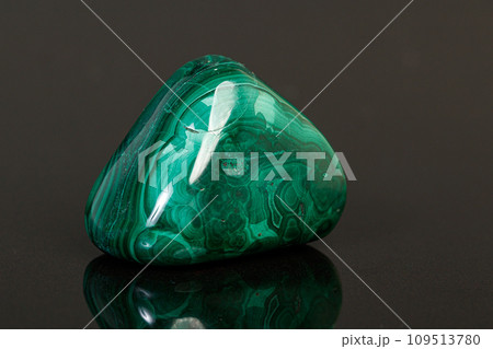 macro mineral stone malachite on a black background 109513780