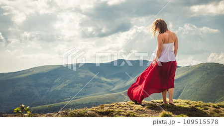 Young woman on the top of mountain 109515578