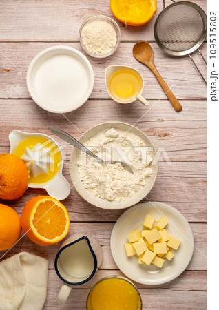 Cooking upside down cake. Baking ingredients with orange fruits. Flour, sugar, milk, butter. Cooking upside down cake. Baking ingredients with orange fruits. Flour, sugar, milk, butter. 109515802