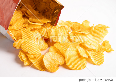 Potato chips, delicious BBQ seasoning spicy for crips, thin slice deep fried snack fast food in open bag. Potato chips, delicious BBQ seasoning spicy for crips, thin slice deep fried snack fast food in open bag. 109516458