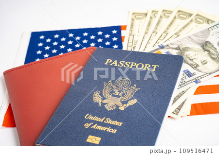 US passport issued to citizen and national of the United States of America to travel in most countries outside with USA flag and dollar money. 109516471