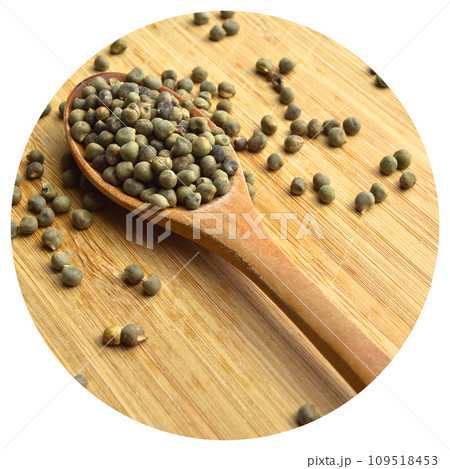 Dried okra seeds in wooden spoon, on bamboo cutting board Dried okra seeds in wooden spoon, on bamboo cutting board 109518453