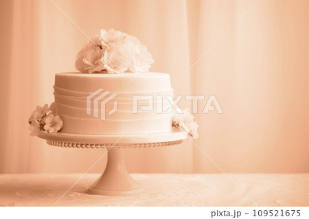 AI-generated content. A beautiful peach-colored birthday cake on a background with a place to copy. AI-generated content. A beautiful peach-colored birthday cake on a background with a place to copy. 109521675
