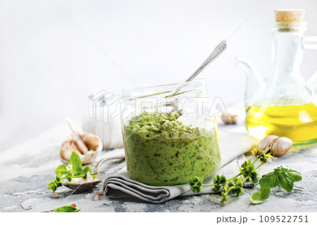 pesto sauce in glass jar, sauce from basil pesto sauce in glass jar, sauce from basil 109522751