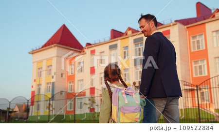 father leads girl daughter by hand school, family, school education building first-grader child, backpack children's knowledge, little child kid girl daughter, daddy little schoolgirl going class father leads girl daughter by hand school, family, school education building first-grader child, backpack children's knowledge, little child kid girl daughter, daddy little schoolgirl going class 109522884
