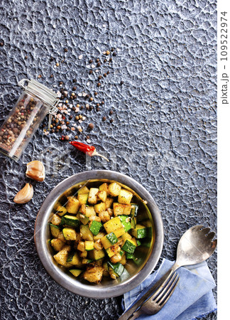 Sliced spiced zucchini with oil, salt and garlic 109522974