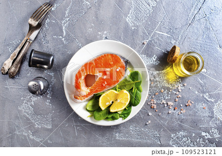 raw salmon steaks and different spices, diet food raw salmon steaks and different spices, diet food 109523121