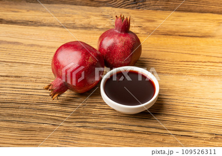 Pomegranate Sauce, Sirup, Dressing, Red Ripe Fruit Syrup with Red Ripe Whole Fruit Group 109526311