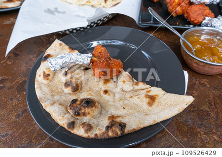 Indian Flat Bread Closeup, Traditional Flatbread also Known as Pita Bread, Roti, Chapati, Naan or Tortilla 109526429