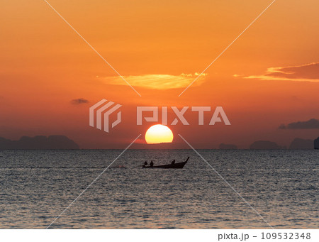 Beautiful sunrise in the sea and orange sky at Phuket city 109532348