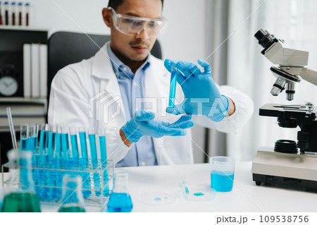 Healthcare professional holding Coronavirus COVID 19 vaccine in laboratory study and analyze scientific sample of Coronavirus antibody in lab. Healthcare professional holding Coronavirus COVID 19 vaccine in laboratory study and analyze scientific sample of Coronavirus antibody in lab. 109538756