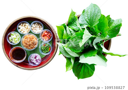Top view of A royal leaf wrap appetizer, call Miang kham, focus selective Top view of A royal leaf wrap appetizer, call Miang kham, focus selective 109538827