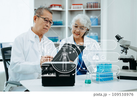 Scientist two Asian senior with tablet, laboratory and ecofriendly science. Agriculture, research and scientists with online reading, test samples for global warming a. with virtual icon Scientist two Asian senior with tablet, laboratory and ecofriendly science. Agriculture, research and scientists with online reading, test samples for global warming a. with virtual icon 109538976