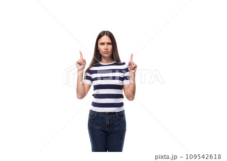 young slender European woman with black straight hair wearing a striped black and white T-shirt young slender European woman with black straight hair wearing a striped black and white T-shirt 109542618