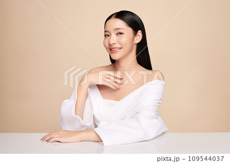 Beautiful young asian woman with clean fresh skin on beige background, Face care, Facial treatment, Cosmetology, beauty and spa, Asian women portrait. 109544037