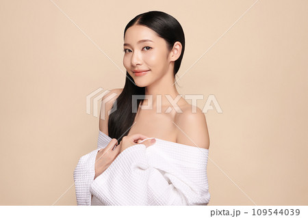 Beautiful young asian woman with clean fresh skin on beige background, Face care, Facial treatment, Cosmetology, beauty and spa, Asian women portrait. 109544039