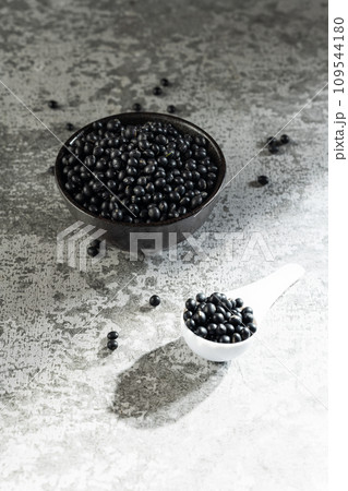 Black beans on gray background Black beans on gray background 109544180