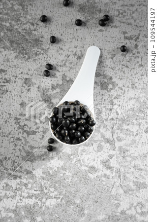 Black beans on gray background Black beans on gray background 109544197