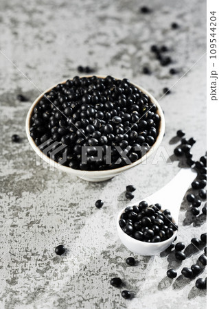 Black beans on gray background Black beans on gray background 109544204