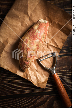 Sweet potatoes on the wooden board Sweet potatoes on the wooden board 109544649