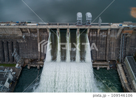 Aerial view of water discharge at hydroelectric power plant Aerial view of water discharge at hydroelectric power plant 109546106