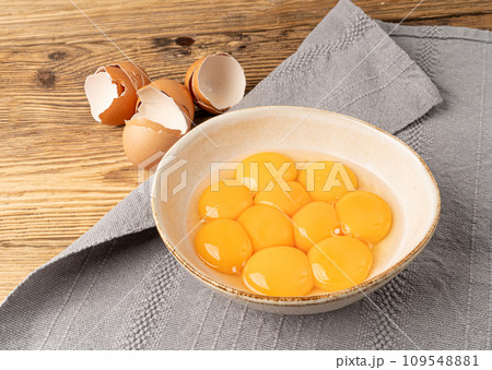 Egg Yolks in Bowl, Fresh Chicken Egg Yolk Separated from Whites for Cooking Recipe, Organic Yolks Top View Egg Yolks in Bowl, Fresh Chicken Egg Yolk Separated from Whites for Cooking Recipe, Organic Yolks Top View 109548881