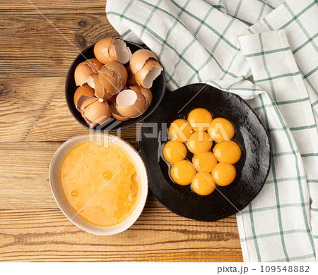 Egg Yolks in Bowl, Fresh Chicken Egg Yolk Separated from Whites for Cooking Recipe, Organic Yolks Top View Egg Yolks in Bowl, Fresh Chicken Egg Yolk Separated from Whites for Cooking Recipe, Organic Yolks Top View 109548882