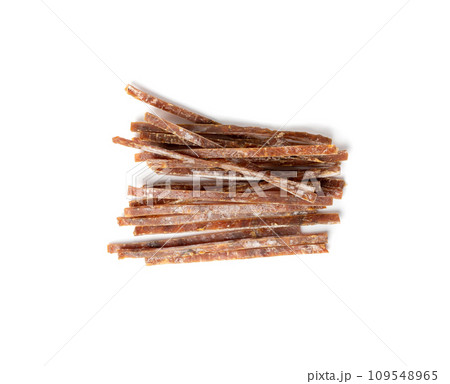 Fish Jerky Isolated, Dry Salted Seafood Snack, Hake Stockfish, Small Pieces of Dehydrated Pollock Fish Jerky Isolated, Dry Salted Seafood Snack, Hake Stockfish, Small Pieces of Dehydrated Pollock 109548965