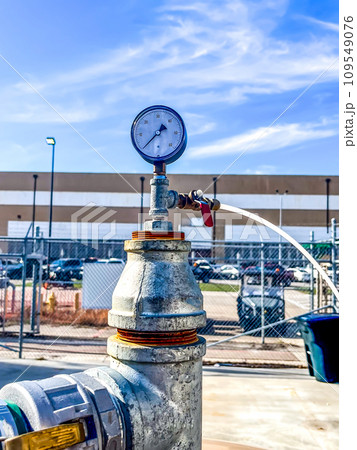 soil vapor extraction test well header with pressure gauge and sample line. 109549076