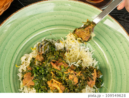 Pilau on Green Plate, Beef Pilaf, Traditional Asian Dish Plov also known as Polow, Pilav, Pallao, Pulao, Palaw 109549628