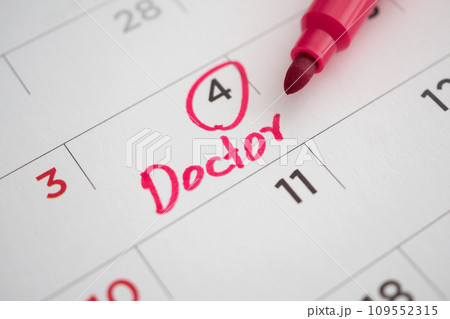 important doctor appointment schedule write on white calendar page date close up 109552315
